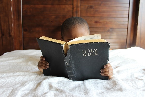 Black-Child-Reading-an-Old-Bible-600×400-1